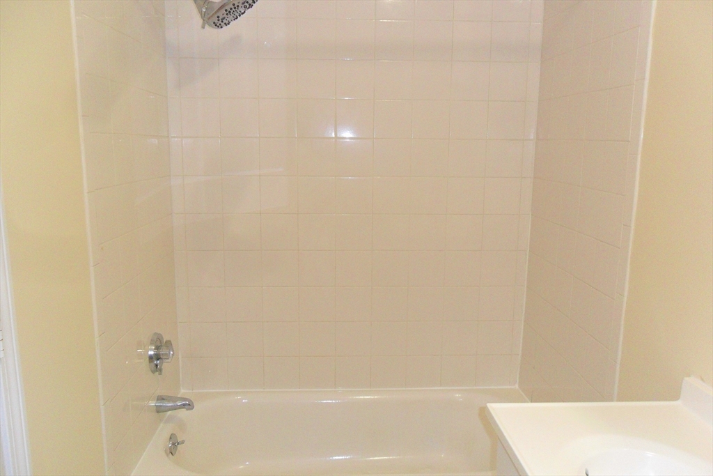 848 Waverly Street, Unit 4 Framingham, MA 01702 - Photo 5 of 14 a bathroom with a shower