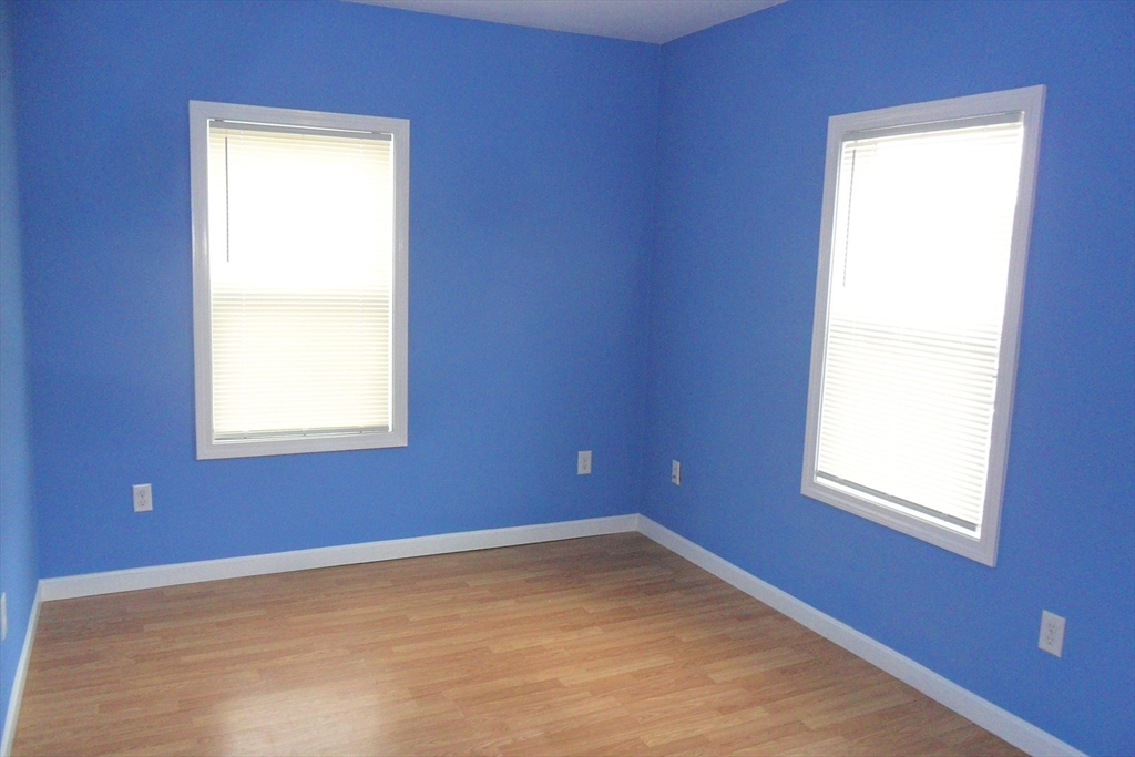 848 Waverly Street, Unit 4 Framingham, MA 01702 - Photo 8 of 14 a view of an empty room with a window