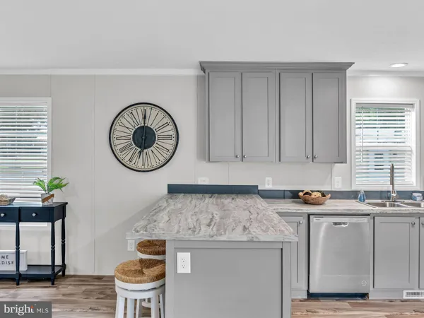 a kitchen with stainless steel appliances granite countertop a stove and a microwave