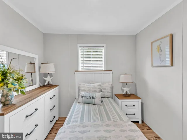 a bedroom with a bed and a dresser