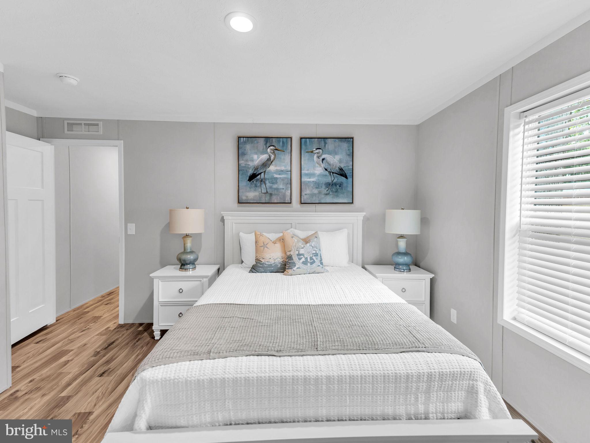 12623 Shell Mill Road, Unit 56 Bishopville, MD 21813 - Photo 37 of 73 a large white bed in a white room