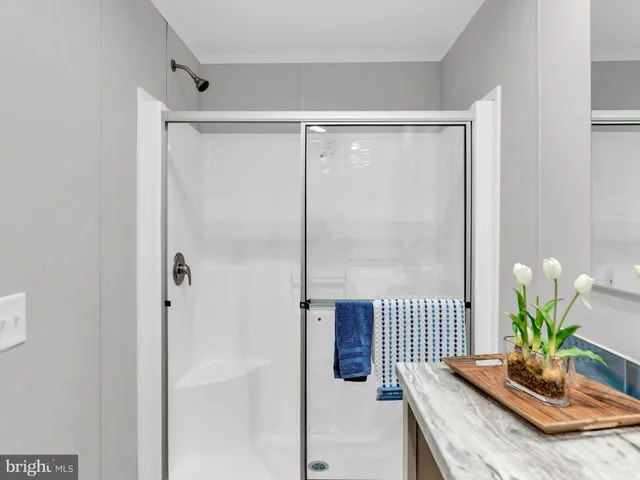 a view of room with hallway and wooden floor