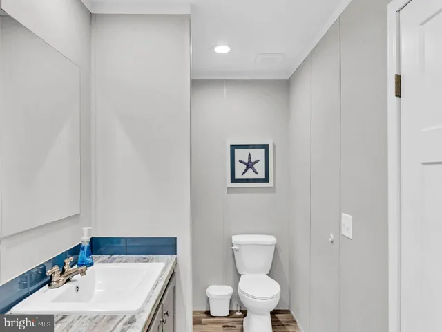 a living room with lots of furniture and kitchen view