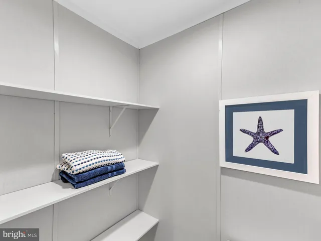 a view of a lake with a table and chairs