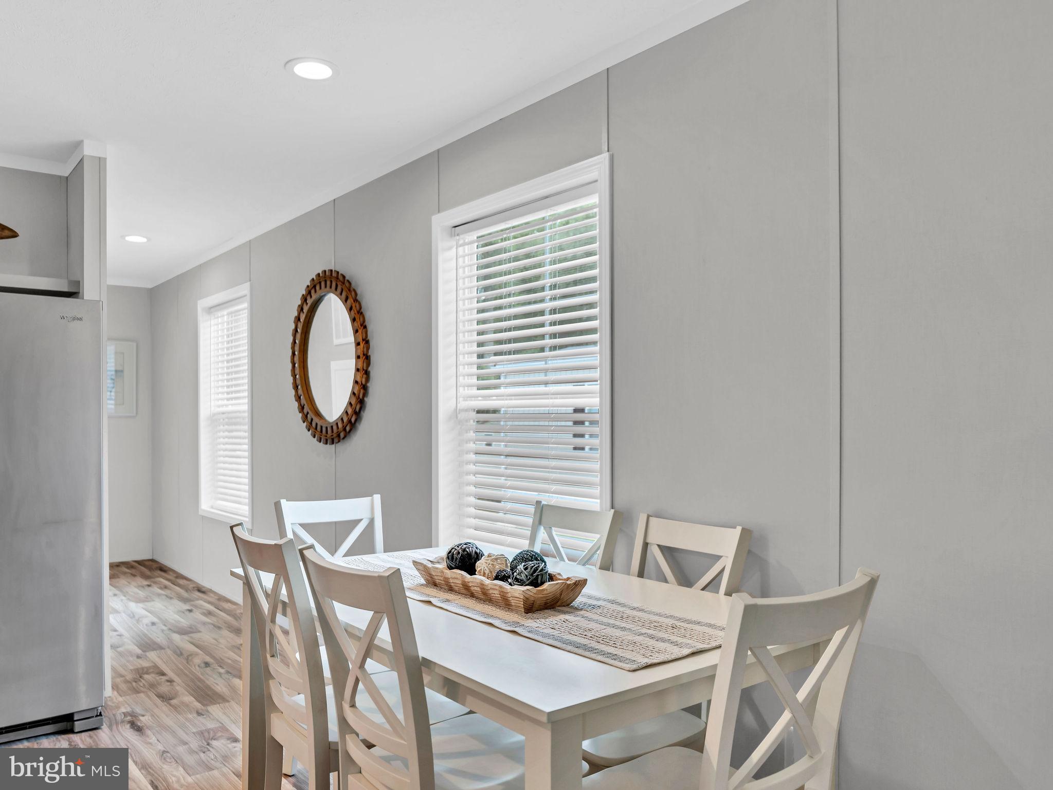 12623 Shell Mill Road, Unit 56 Bishopville, MD 21813 - Photo 10 of 73 a view of a dining room with furniture and a window