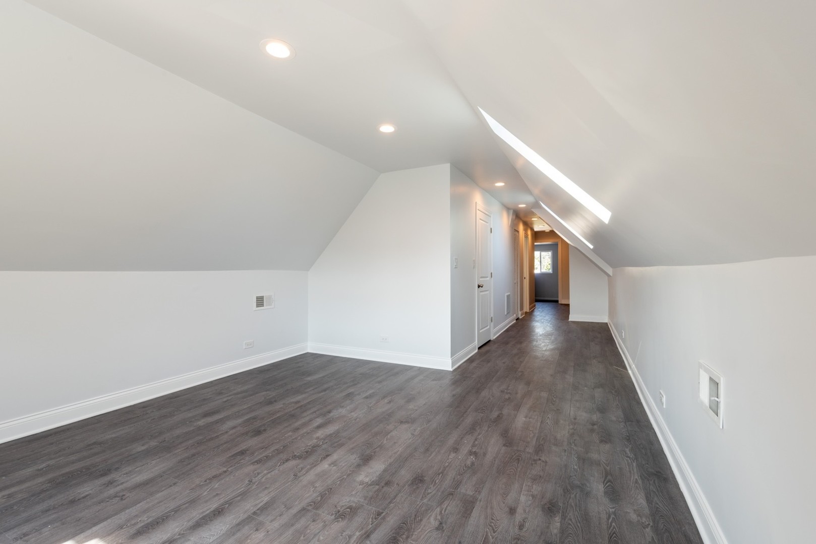 4226 North Bernard Street, Unit 2 Chicago, IL 60618 - Photo 8 of 9 a view of a hallway with wooden floor