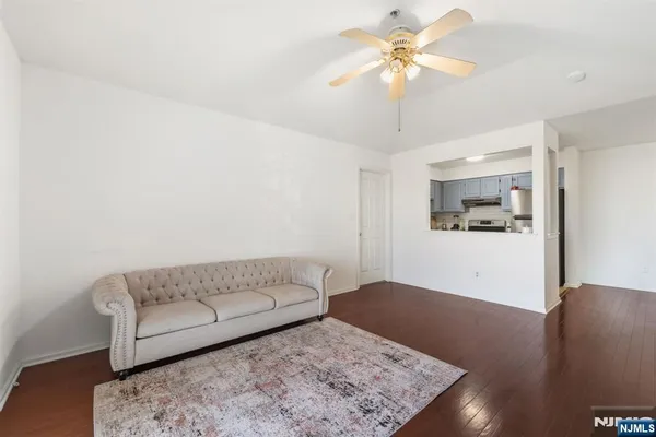 a living room with furniture and a rug