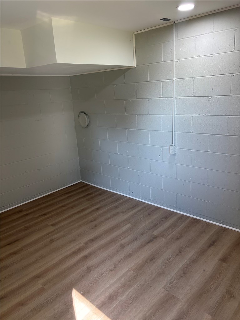 351 Randys Road Westminster, SC 29693 - Photo 25 of 30 A well-lit, unfinished basement room awaits customization with durable laminate flooring.