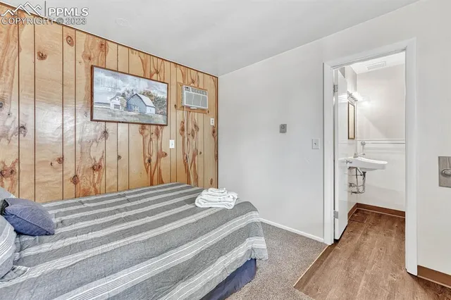 a bedroom with bed and a cabinets