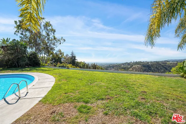 a view of a swimming pool and an outdoor space