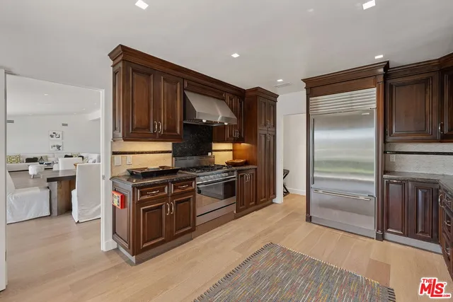 a bedroom with a large bed and a large window