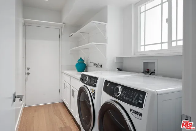 a spacious bedroom with a bed and a couch