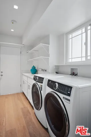 a bedroom with a large bed and a couch