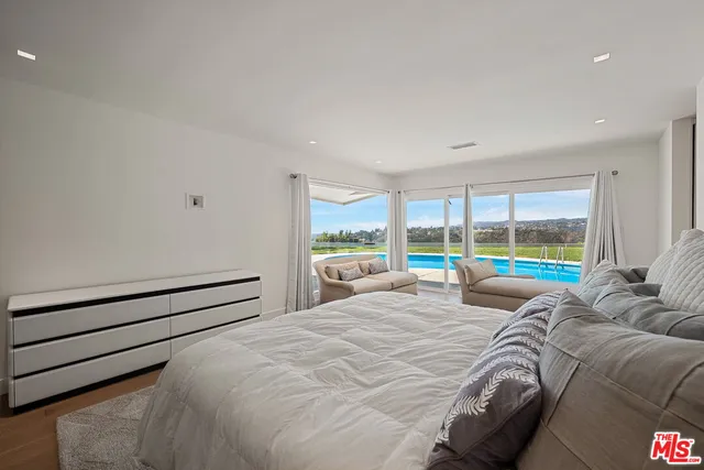 a bathroom with a double vanity sink and shower