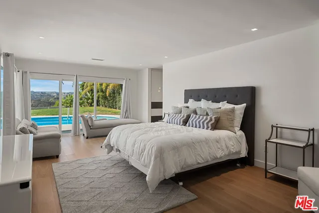 a bathroom with a shower sink and mirror