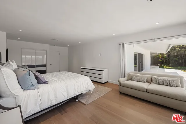 a bathroom with a double vanity sink a and a large mirror