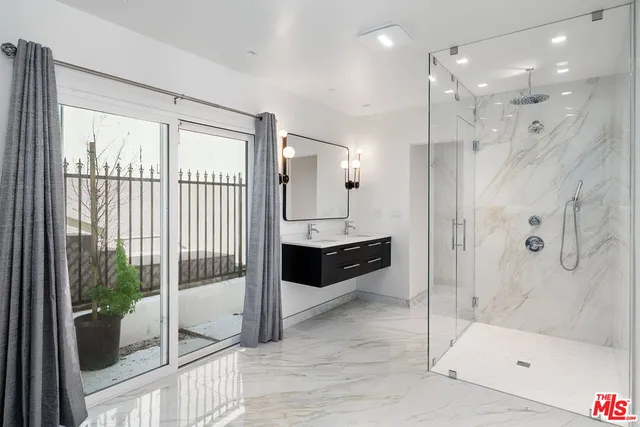 a bathroom with a bathtub and a sink