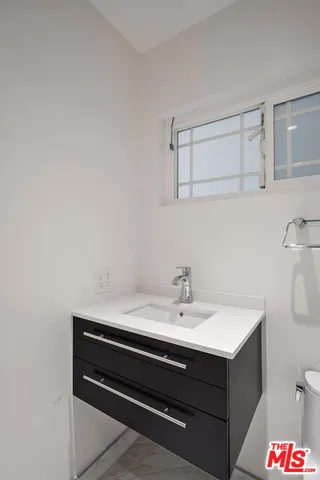 a front view of house with yard and swimming pool