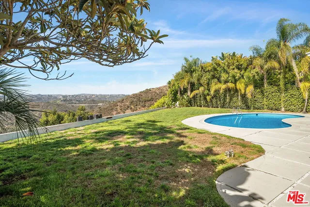a view of a swimming pool with a garden