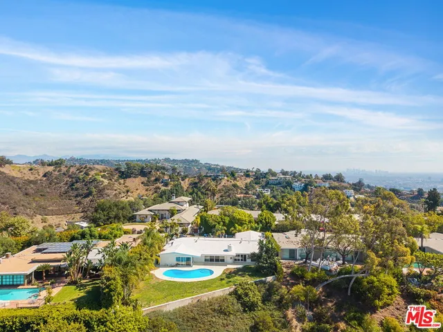 an aerial view of residential houses and outdoor space