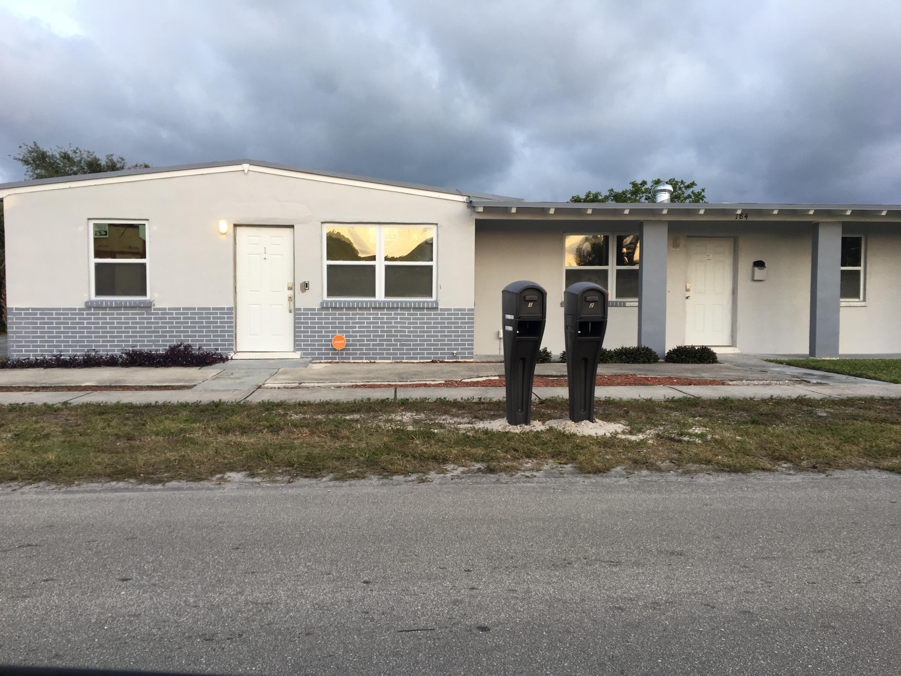 184 West 24th Street Riviera Beach, FL 33404 - Photo 1 of 27 Outside Duplex