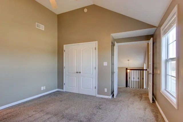 a view of an empty room with windows