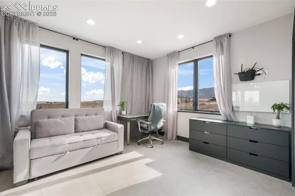 a living room with furniture and windows