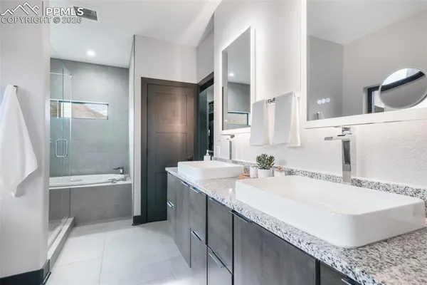 a white bath tub sitting next to a toilet
