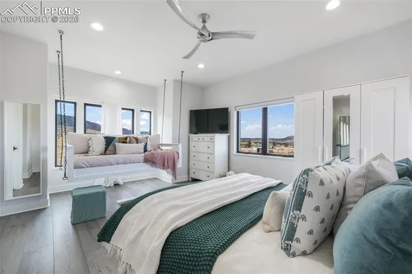 a bedroom with furniture and window