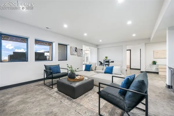 a living room with furniture and a table