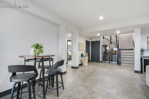 a view of room with stairs and furniture