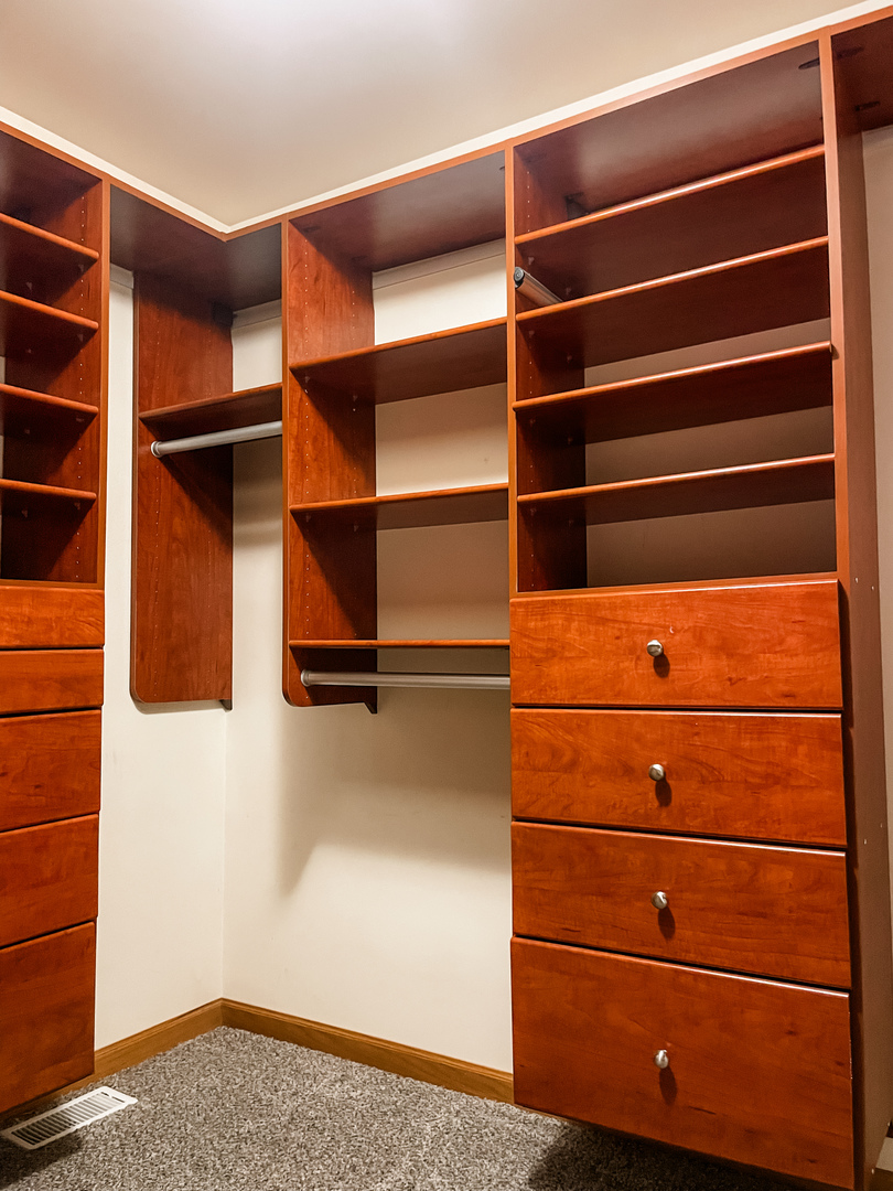 1308 Axcel Lane Sycamore, IL 60178 - Photo 29 of 40 a view of walk in closet with empty racks