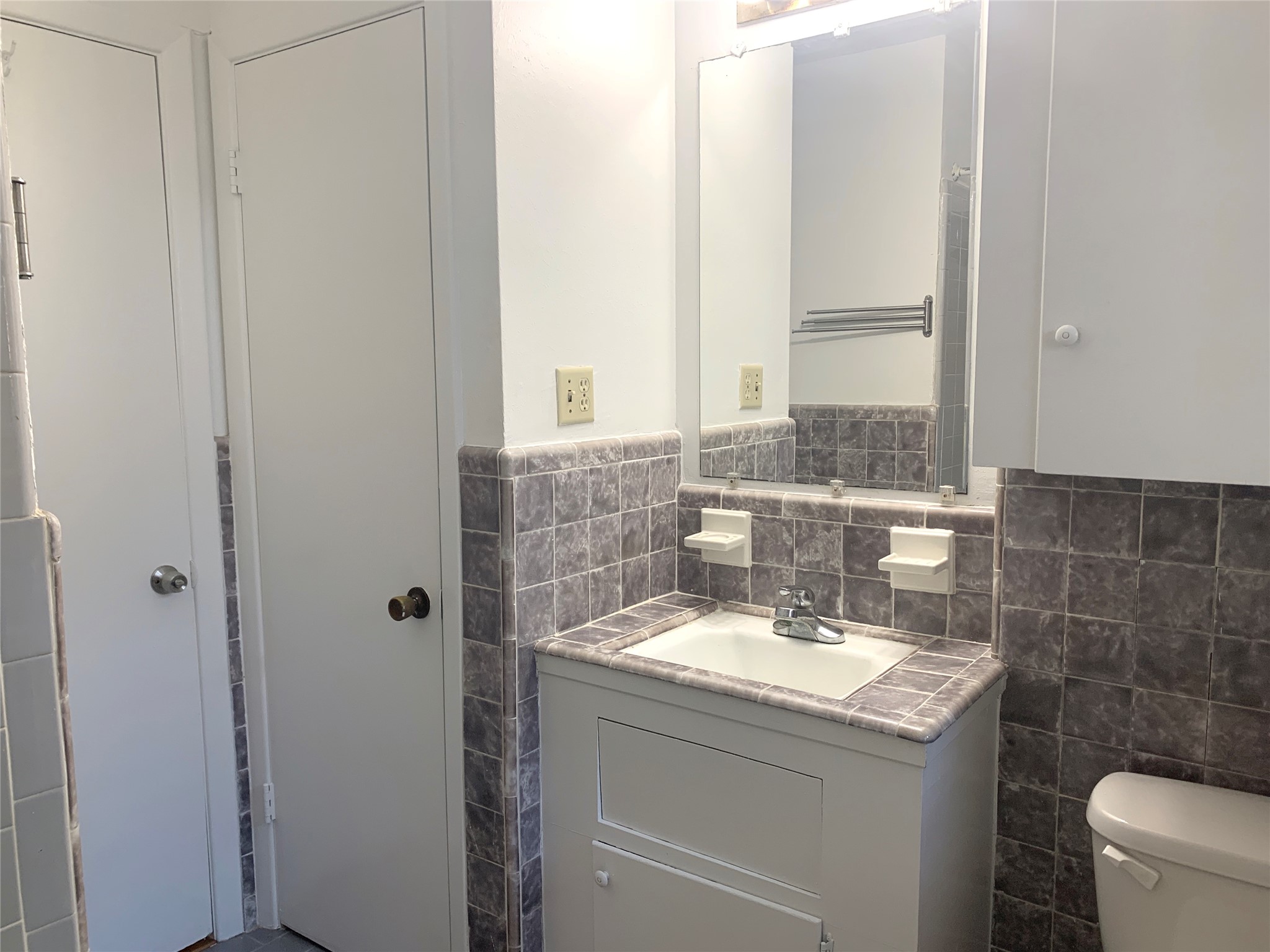 4427 Warm Springs Road Houston, TX 77035 - Photo 19 of 30 View of hall/guest bathroom with linen closet and storage cobinet for toiletries.