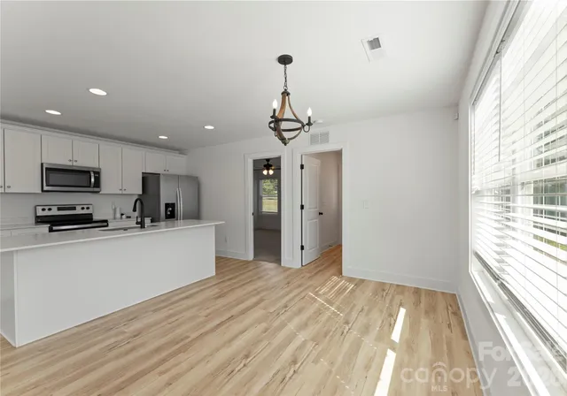 a view of a backyard of the house