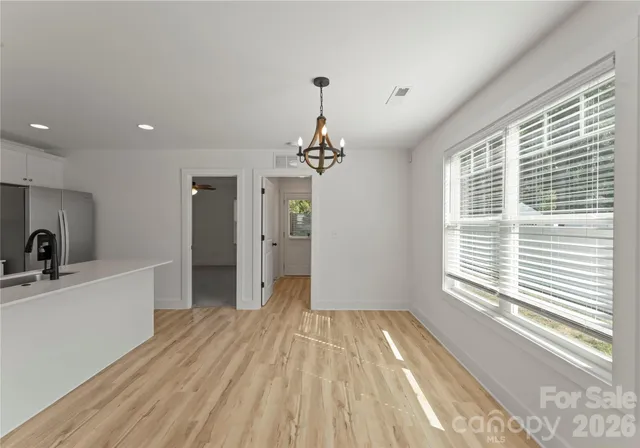 a swimming pool that is in the backyard of house