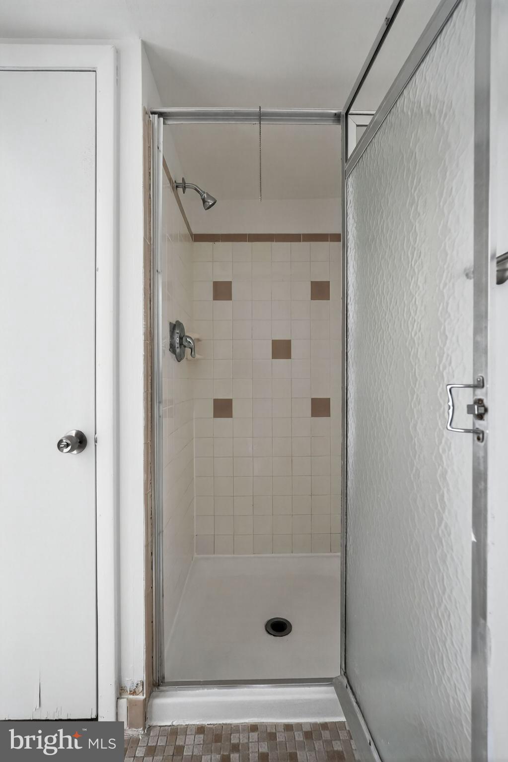 800 South Avenue, Unit B4 Secane, PA 19018 - Photo 14 of 16 a bathroom with a glass shower door