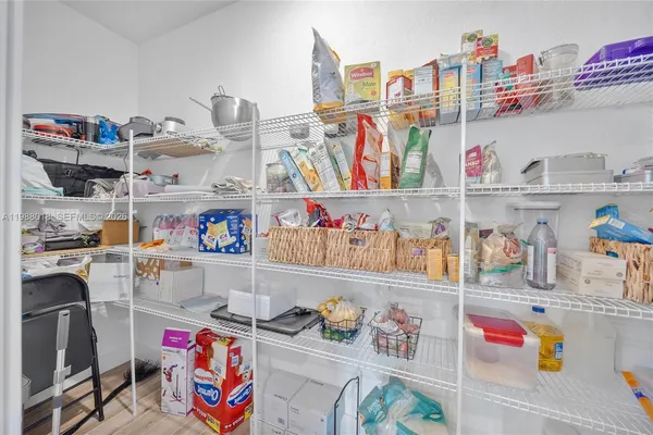 a utility room with lots of clutter and toys