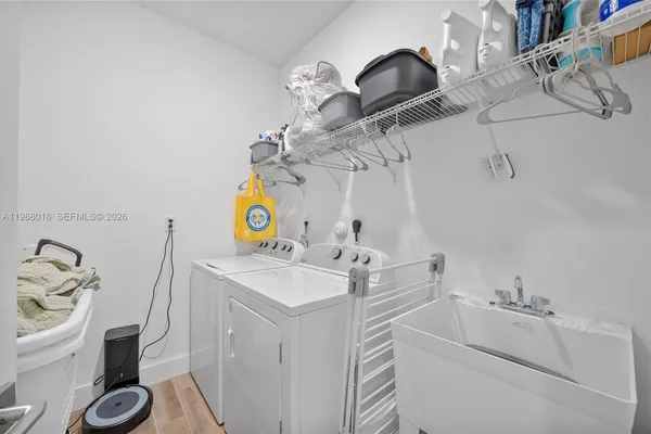 a bathroom with a sink vanity and mirror