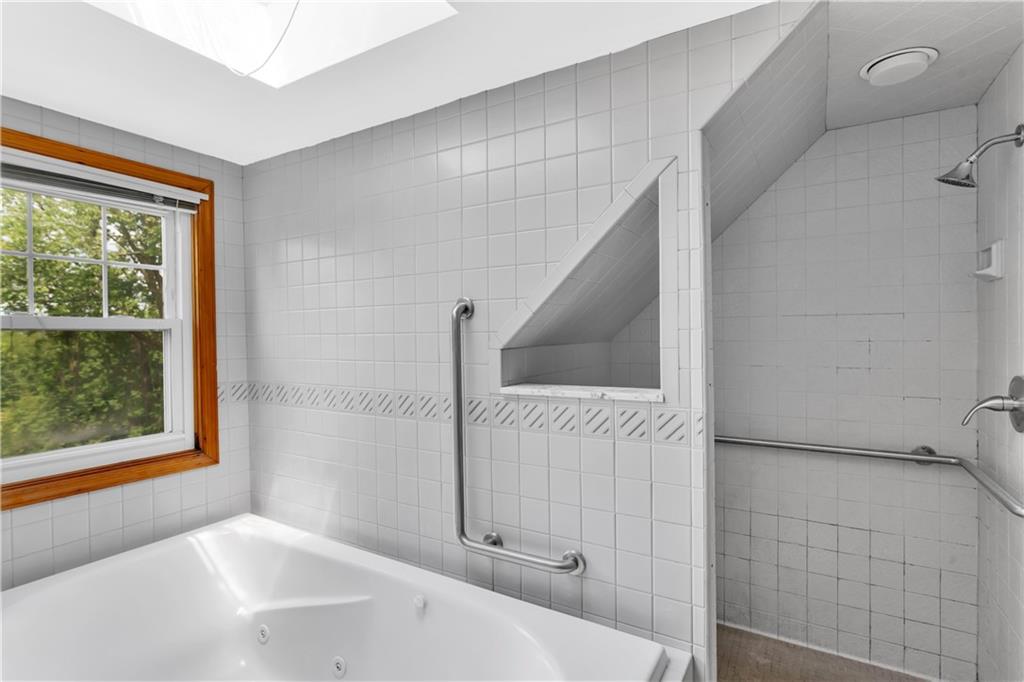 51 Revo Road Pittsburgh, PA 15236 - Photo 22 of 38 A skylight brightens the upper-level bath, creating a spa-like retreat.
