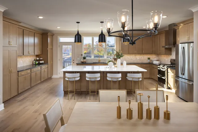 a large kitchen with a table and chairs