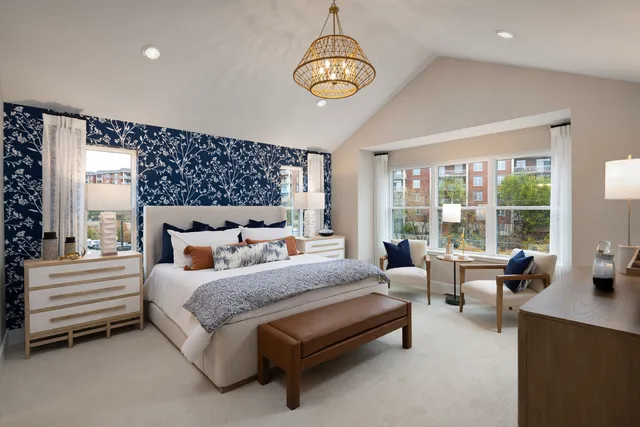 a bedroom with bed and wooden floor