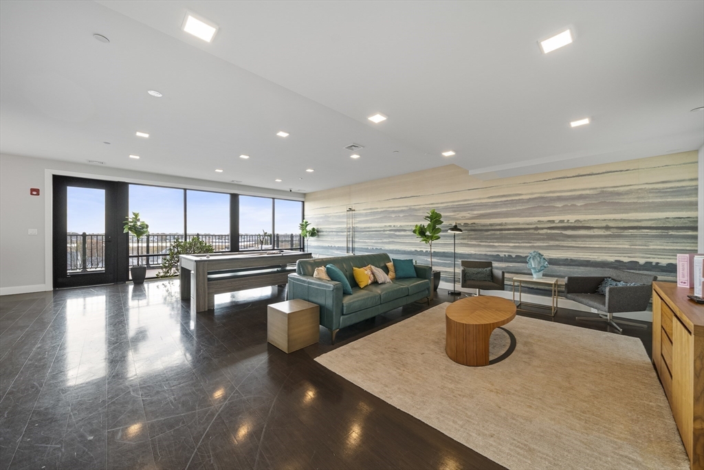 11 Walley Street, Unit 202 Boston, MA 02128 - Photo 23 of 24 a kitchen with a table and chairs