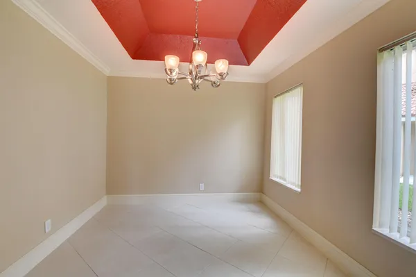 a kitchen with stainless steel appliances granite countertop a refrigerator and a stove