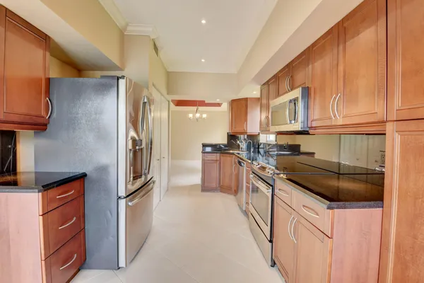 a spacious bedroom with a bed and a flat screen television