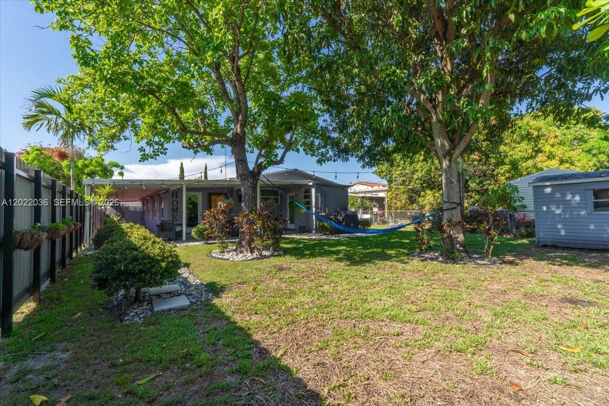 120 West 50th Street Hialeah, FL 33012 - Photo 19 of 22 a front view of a house with yard patio and green space