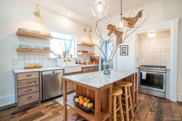 a very nice looking kitchen with a wooden floor