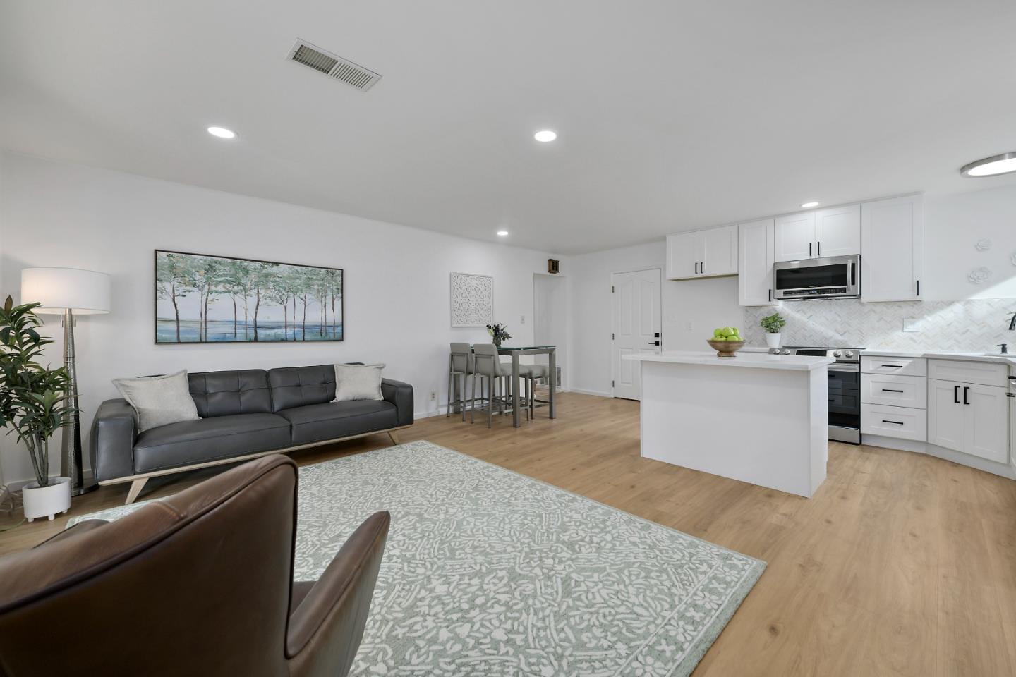 10275 Farallone Drive Cupertino, CA 95014 - Photo 12 of 17 a living room with furniture and a wooden floor