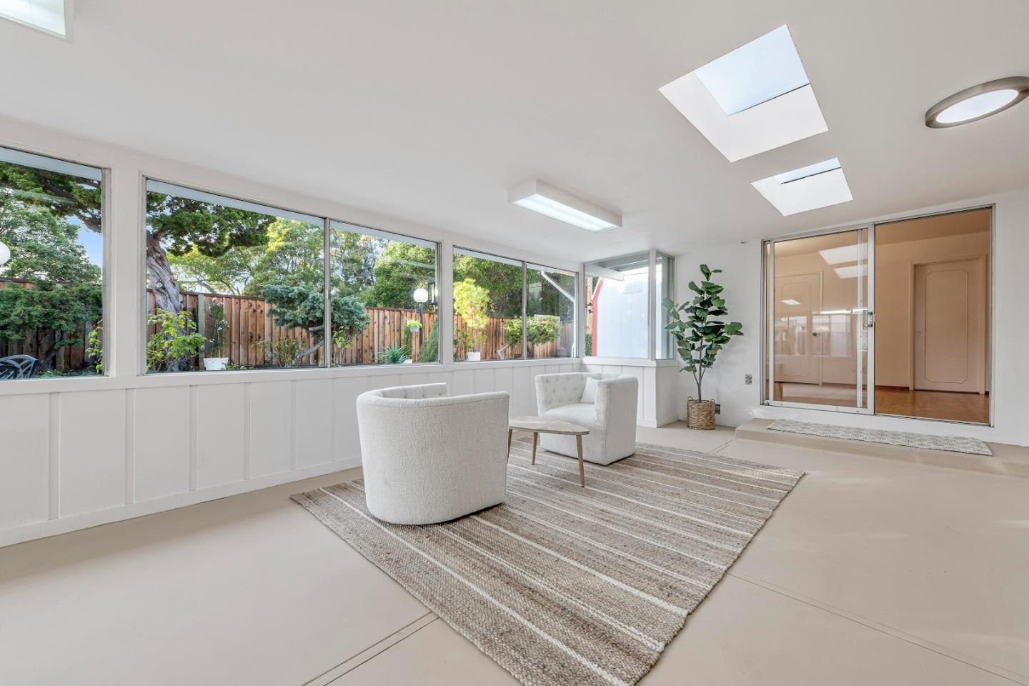 10275 Farallone Drive Cupertino, CA 95014 - Photo 13 of 17 a living room with a large window a table and chairs