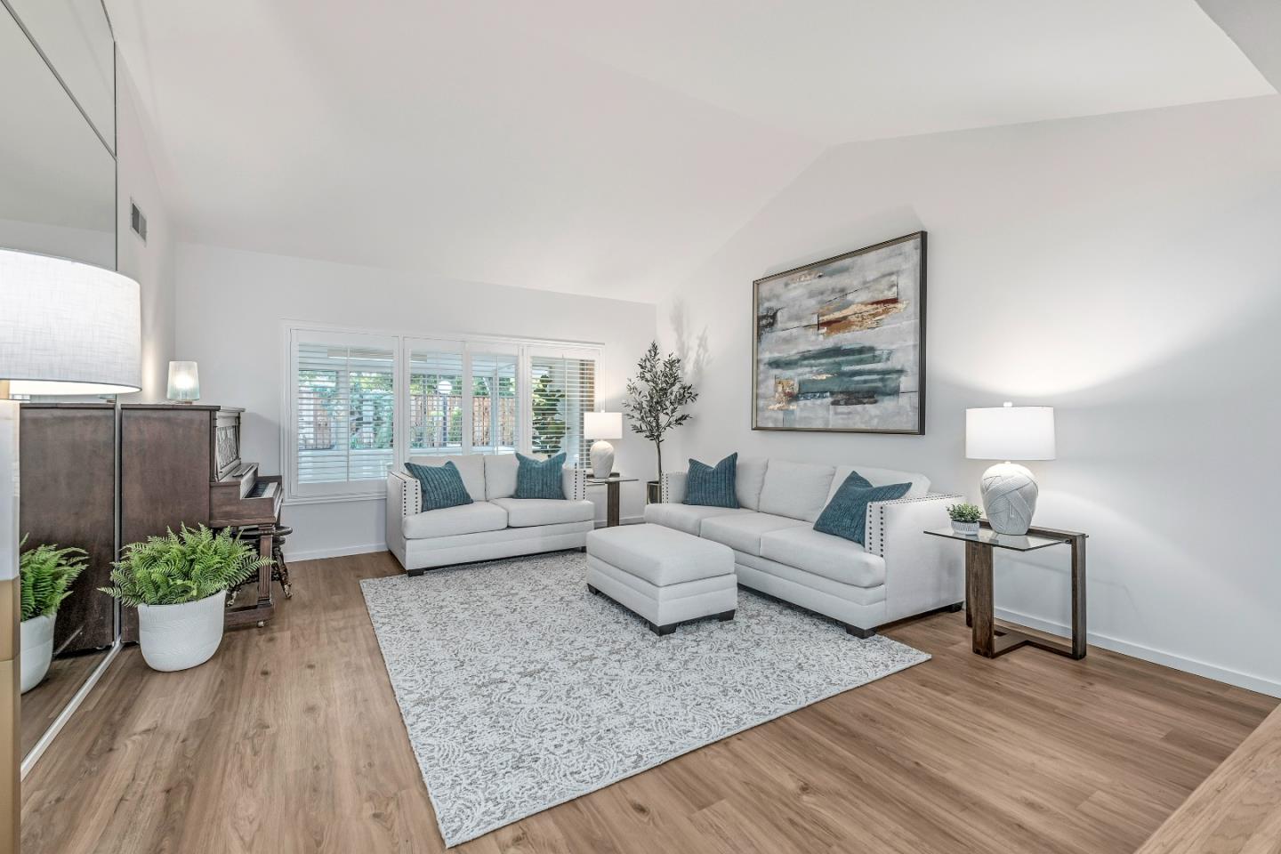 10275 Farallone Drive Cupertino, CA 95014 - Photo 4 of 17 a living room with furniture and a potted plant