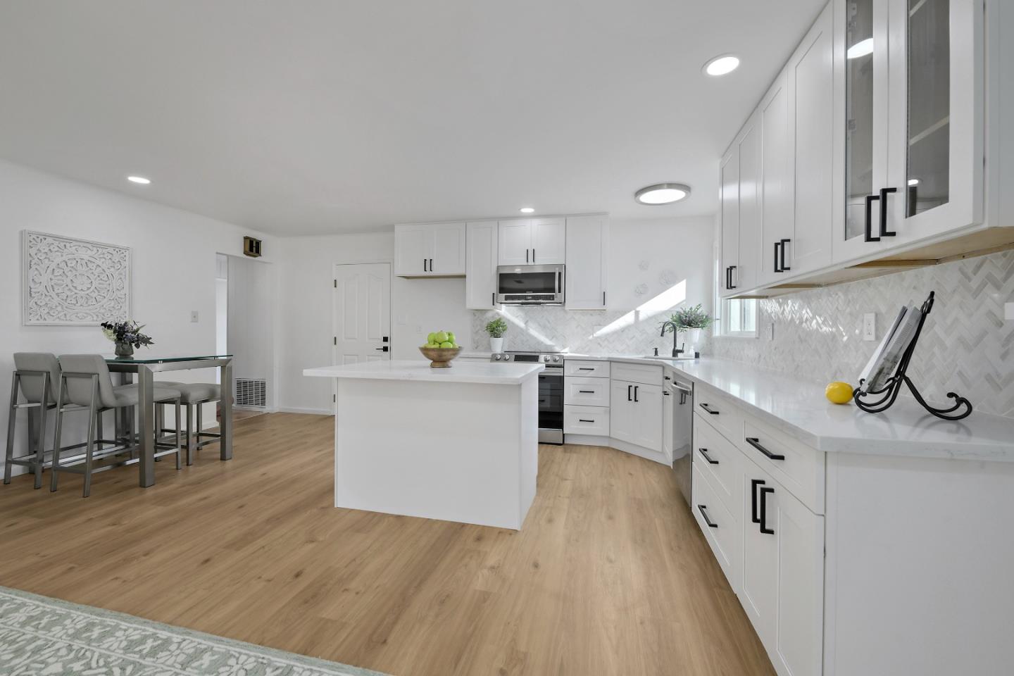 10275 Farallone Drive Cupertino, CA 95014 - Photo 6 of 17 a kitchen with cabinets a sink and wooden floors